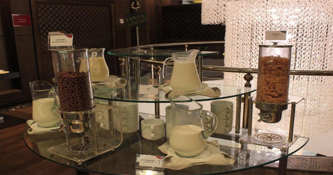 Crowne Plaza Madinah By Ihg Hotel Medina Exterior photo A coffee station with various types of milk